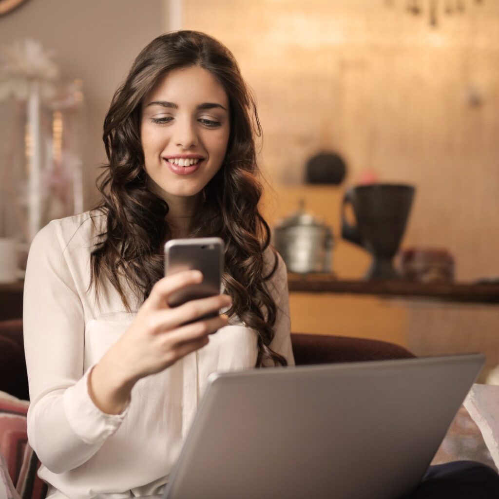 woman-sitting-on-sofa-while-looking-at-phone-with-laptop-on-920382-5e690d37b84af woman-sitting-on-sofa-while-looking-at-phone-with-laptop-on-920382-5e690d37b84af