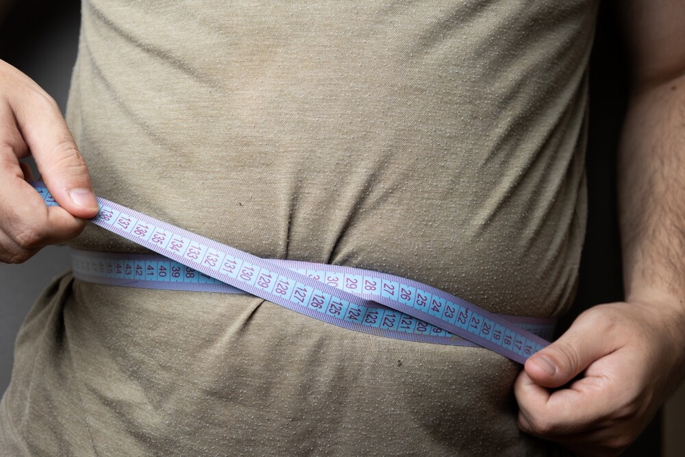 This,Image,Captures,A,Side,View,Of,A,Person,Measuring waist measuring