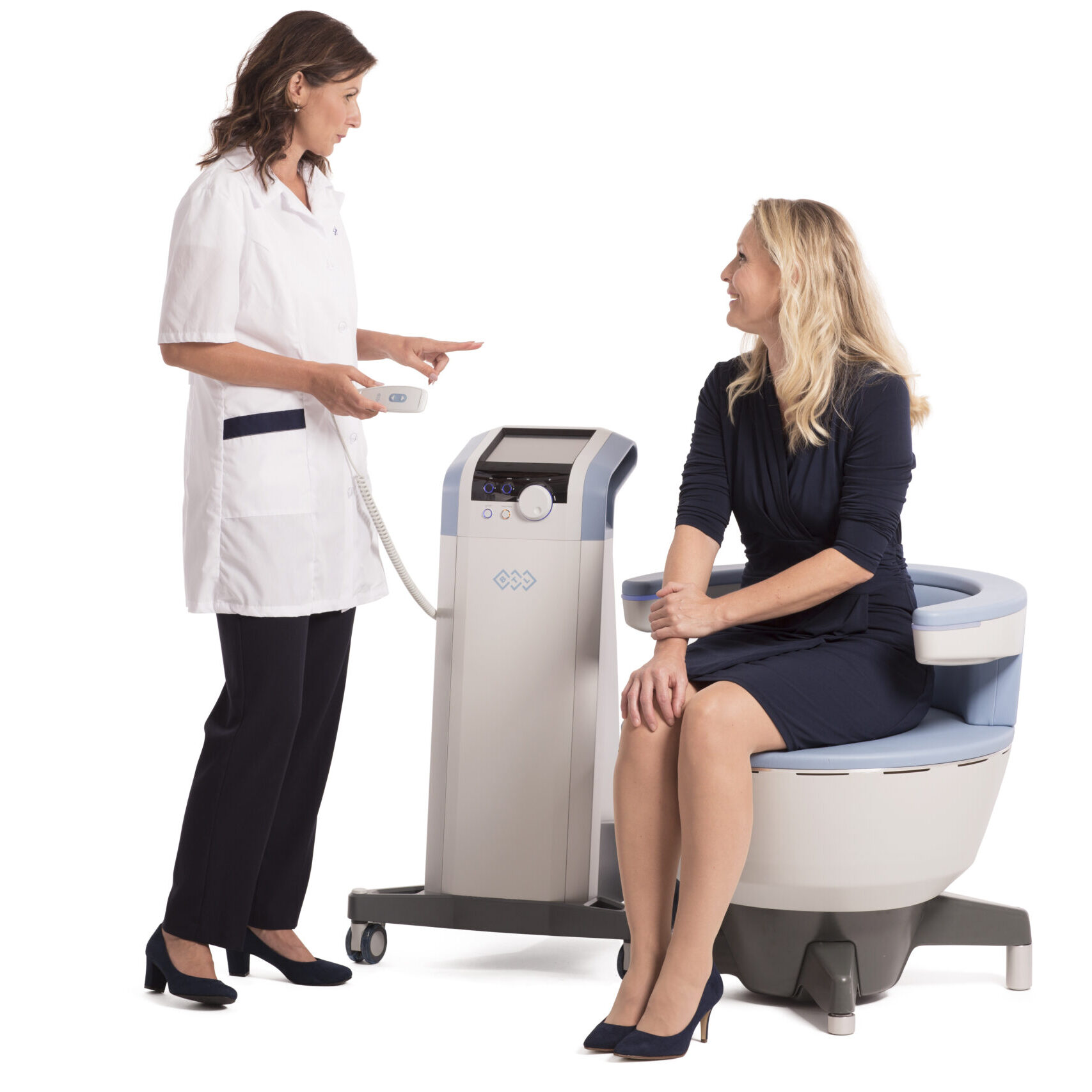 Emsella chair with a patient sitting comfortably and clinician standing beside them Miramont Wellness Centers