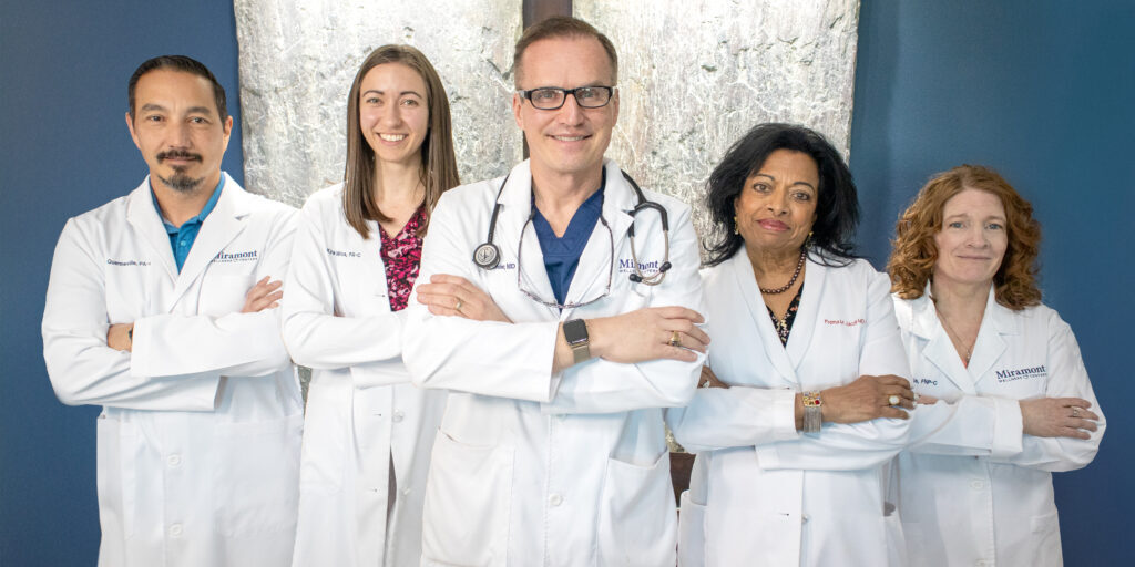 Group of Miramont Clinicians standing smiling with their arms crossed.